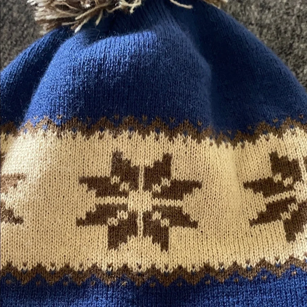 Cirque Blue and Tan Beanie with Colorado Patch. Designed in Vail, CO.